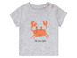 Un t-shirt gris avec un crabe et le texte 'sea you later'.