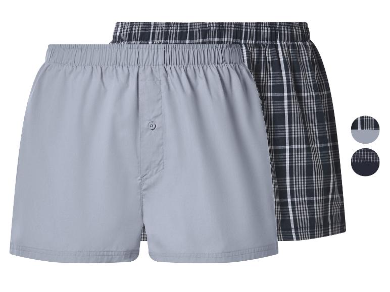 Herenboxershorts, één effen grijs en één geruit in donkerblauw en wit.