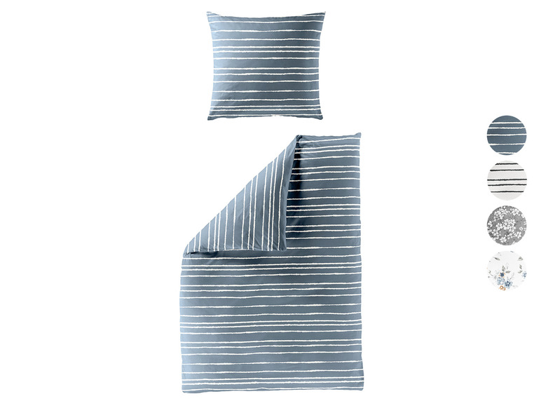 Une parure de lit avec taie d'oreiller, à rayures bleues et blanches.