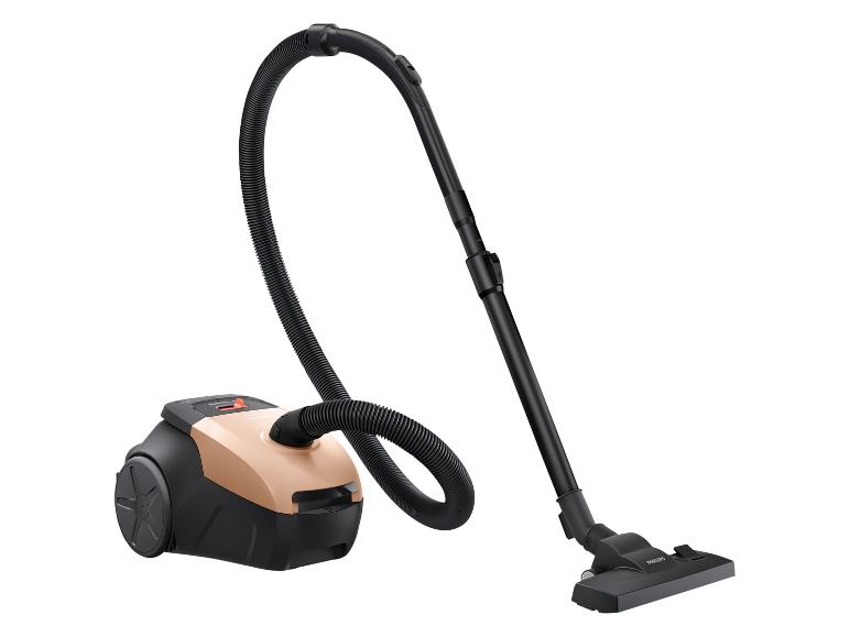 Aspirateur traîneau noir et beige avec tuyau flexible et brosse au sol