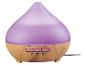 Diffuseur d'arômes violet avec base aspect bois et boutons pour minuterie et lumière.