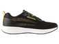 Des baskets noires avec une semelle blanche et des accents jaunes.