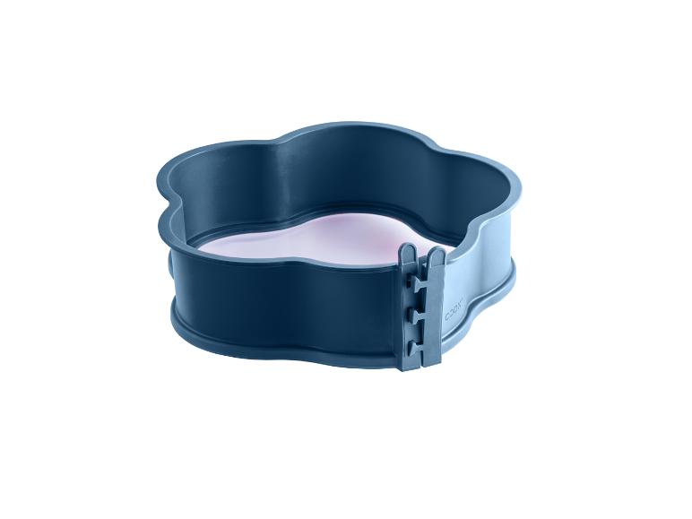 Moule de cuisson en silicone bleu foncé avec fond en forme de cœur et fermeture à boucle.