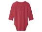 Rode baby romper met lange mouwen, achterkant.
