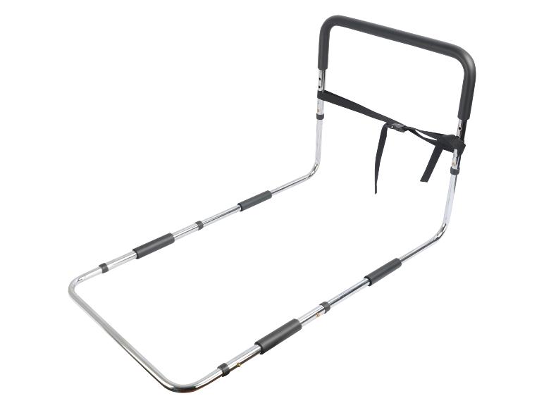 Verchroomde metalen bedbeugel met zwart handvat en bevestigingsriem.