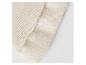Détail d'un tissu côtelé beige et d'une doublure douce.