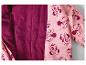 Roze jas met Minnie Mouse-print en paarse fleecevoering.