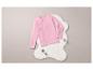 Een roze longsleeve op een wit bontkleed.