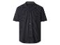 Chemise bleu foncé à manches courtes avec col, rayures verticales et boutons.