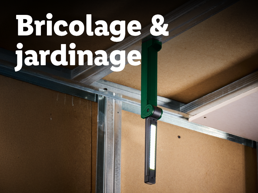 Bricolage et jardinage : une lampe de travail suspendue dans un chantier.