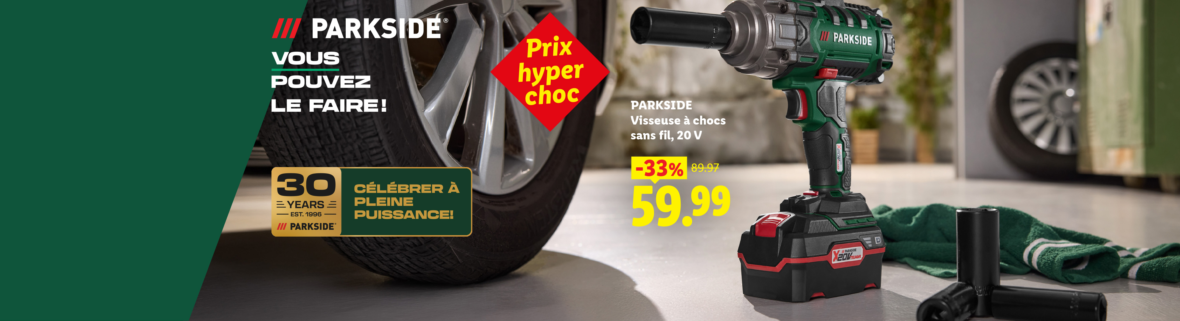 Une visseuse à chocs sans fil de 20 V avec 33% de réduction, maintenant 59,99 €, à côté d'un pneu de voiture.