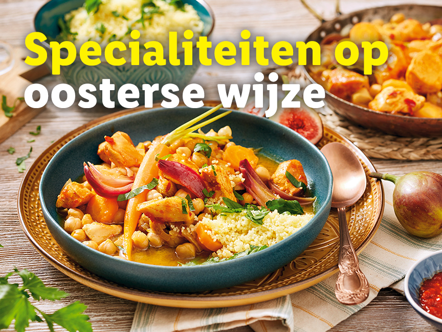 Een bord met Oosterse kipstoofpot met couscous.