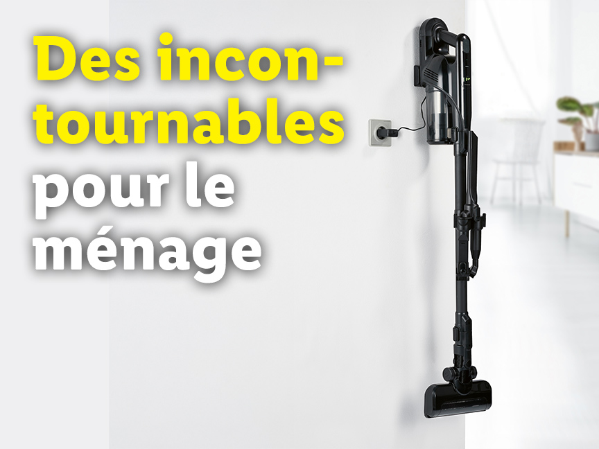 Un aspirateur sans fil rechargeable est fixé au mur, prêt à l'emploi.